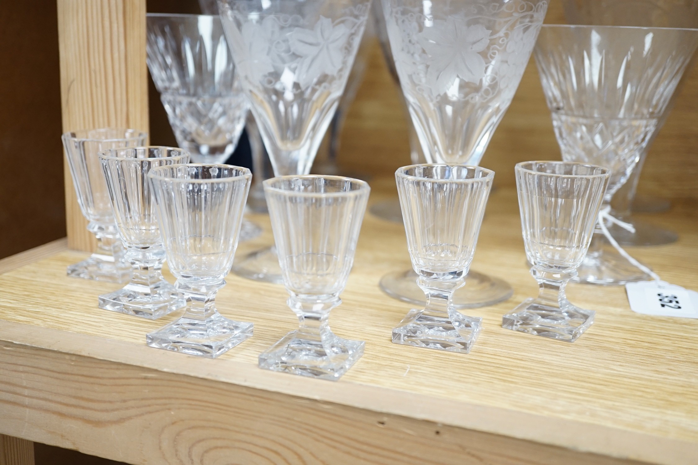 A quantity of engraved and other wine and sherry glasses. Tallest 17cm